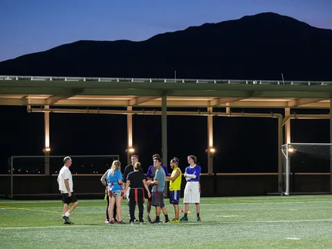 students playing flag football on Alpine Field