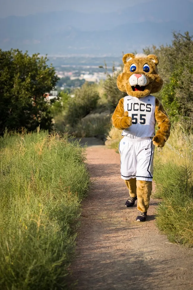 Clyde running on a UCCS trail